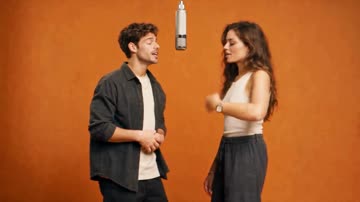 Hotel Lobby AI meme remake example: two performers in an orange booth under a hanging microphone